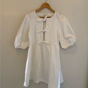 Charming White Kids Dress with Bow Accents